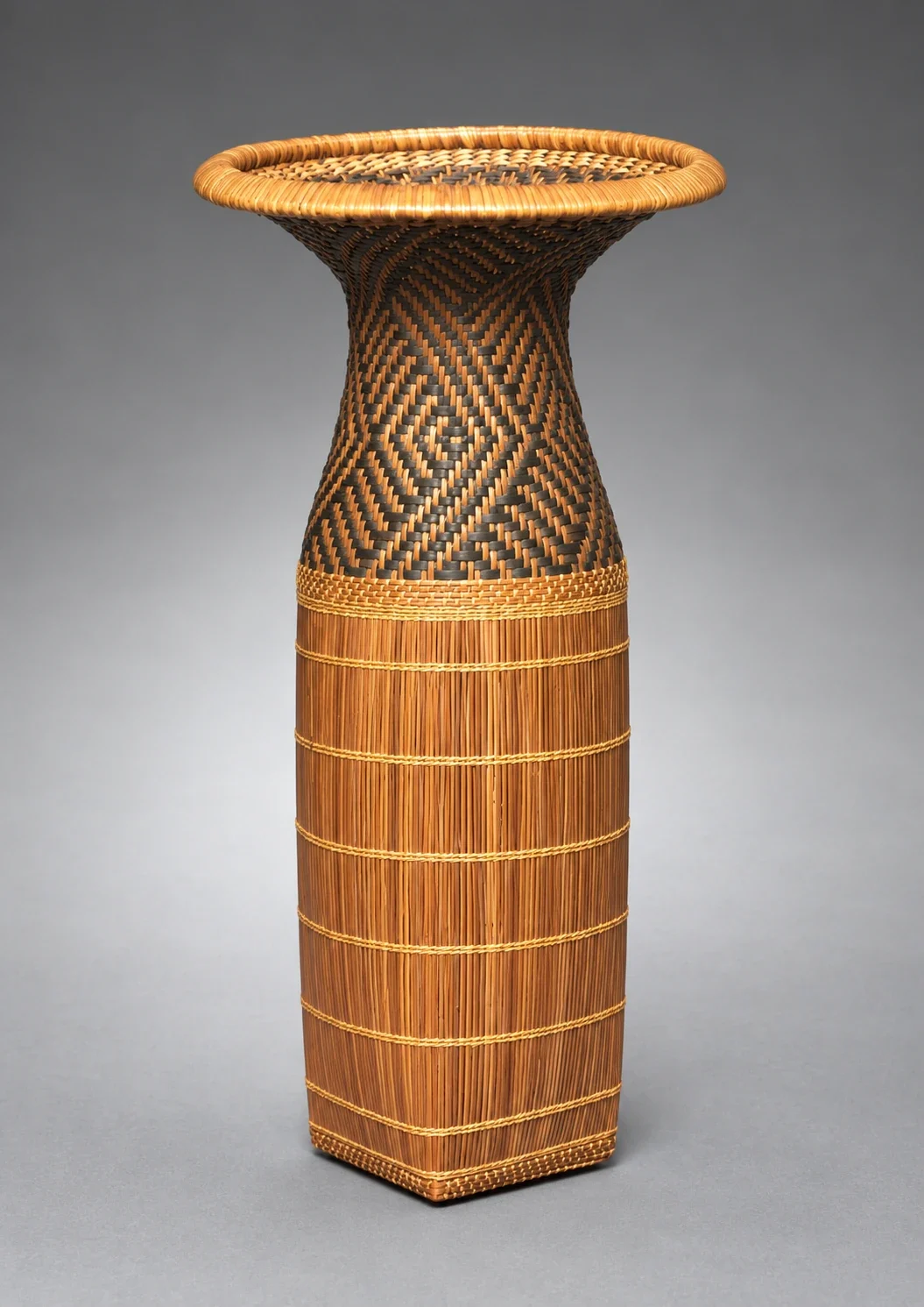 Sifting basket with patterned neck and flared mouth.