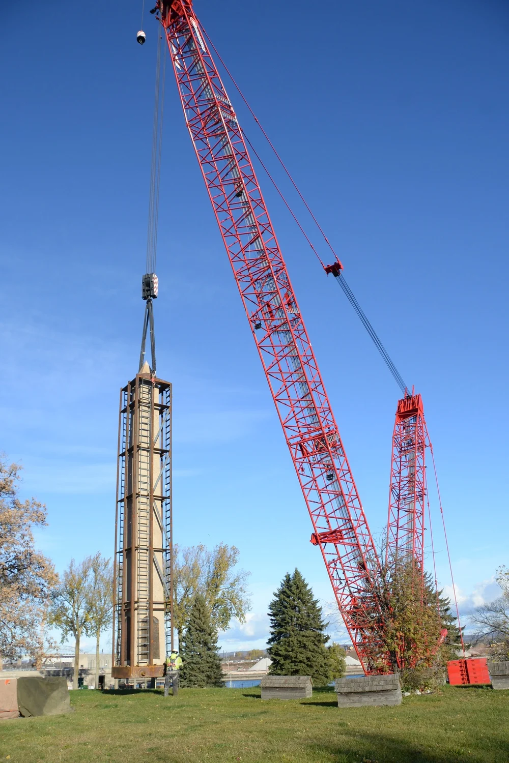 A crane lifts the Soo Locks anniversary obelisk from Brady Park in November 2025 following consultation with the Sault Tribe and Bay Mills Indian Community