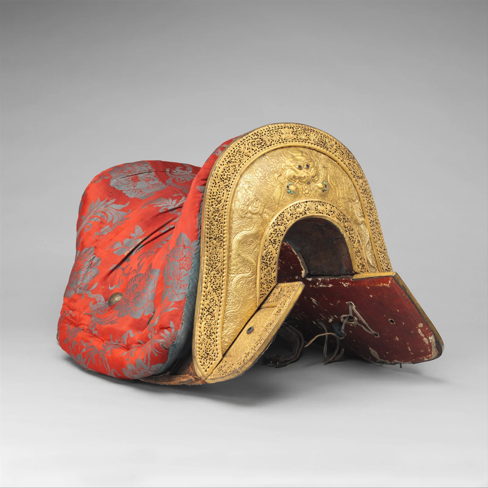 Kīrtimukha face on the gilt-copper plaque of a Tibetan saddle, eighteenth–nineteenth century