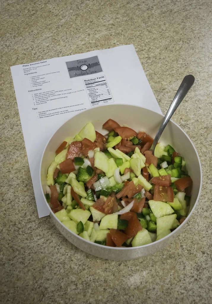Zucchini salad and recipe sheet prepared during a Menominee Nation nutrition-education class in Keshena on 10 September 2014, photographed by USDA’s Bob Nichols