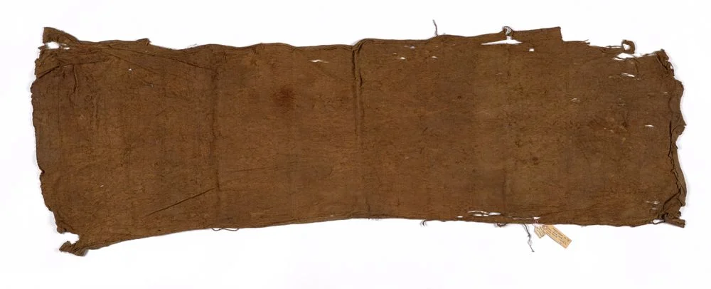 Kanak barkcloth from Ouvéa, New Caledonia, shown whole with worn edges and collection label, Te Papa FE000079