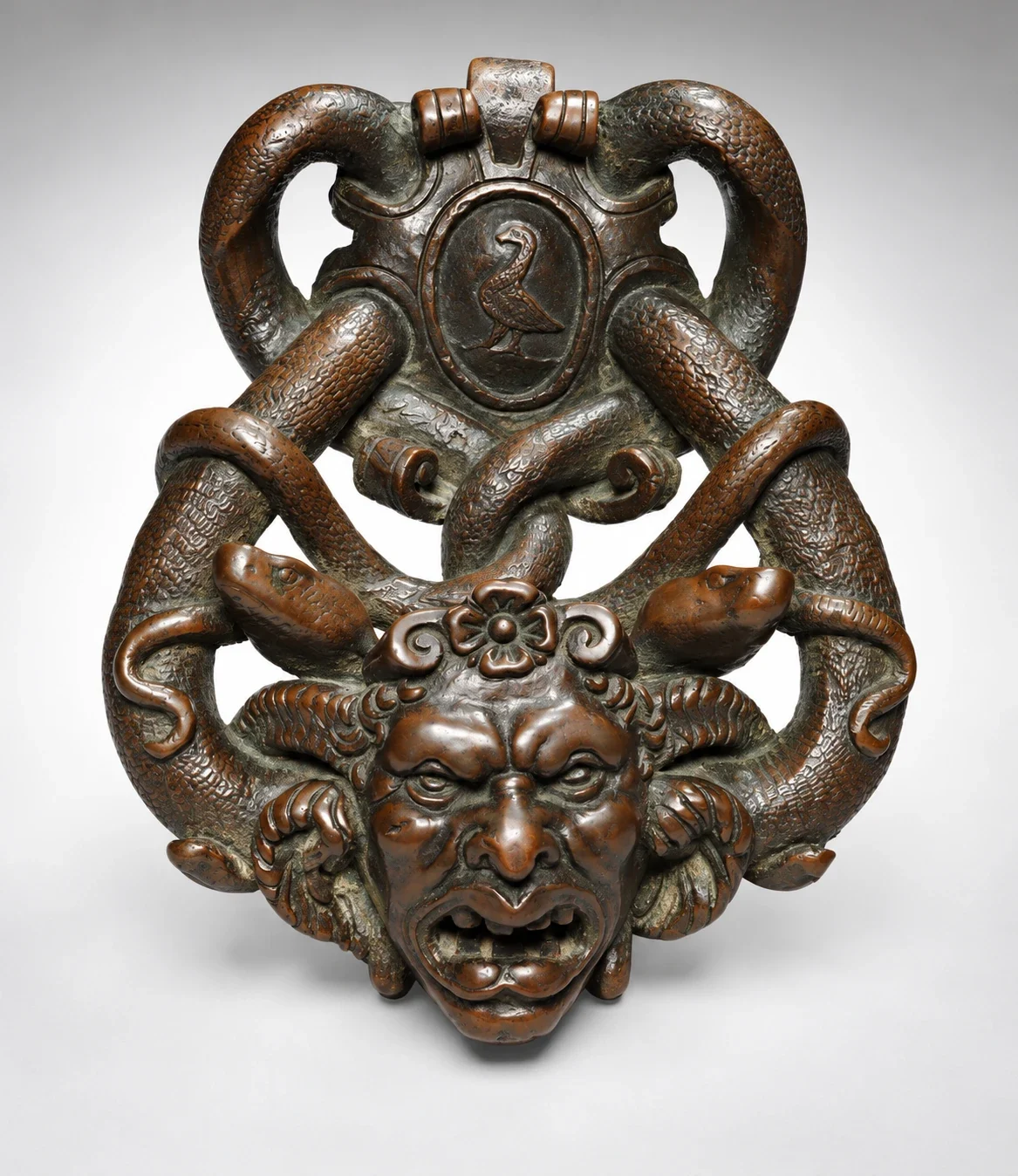 Bronze Gorgon doorknocker with coiling serpents.