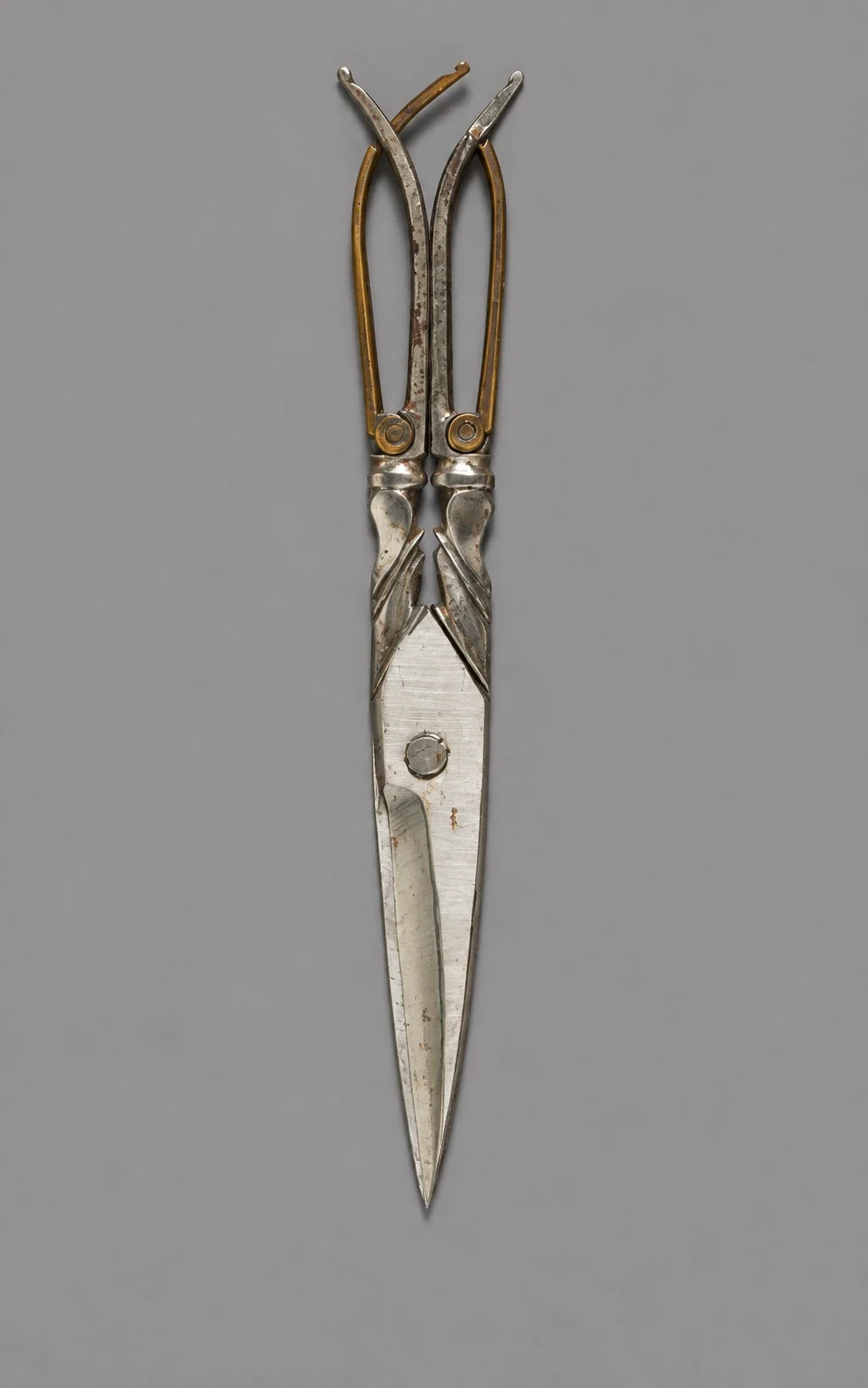 Étui scissors with pointed blades and folding handles.