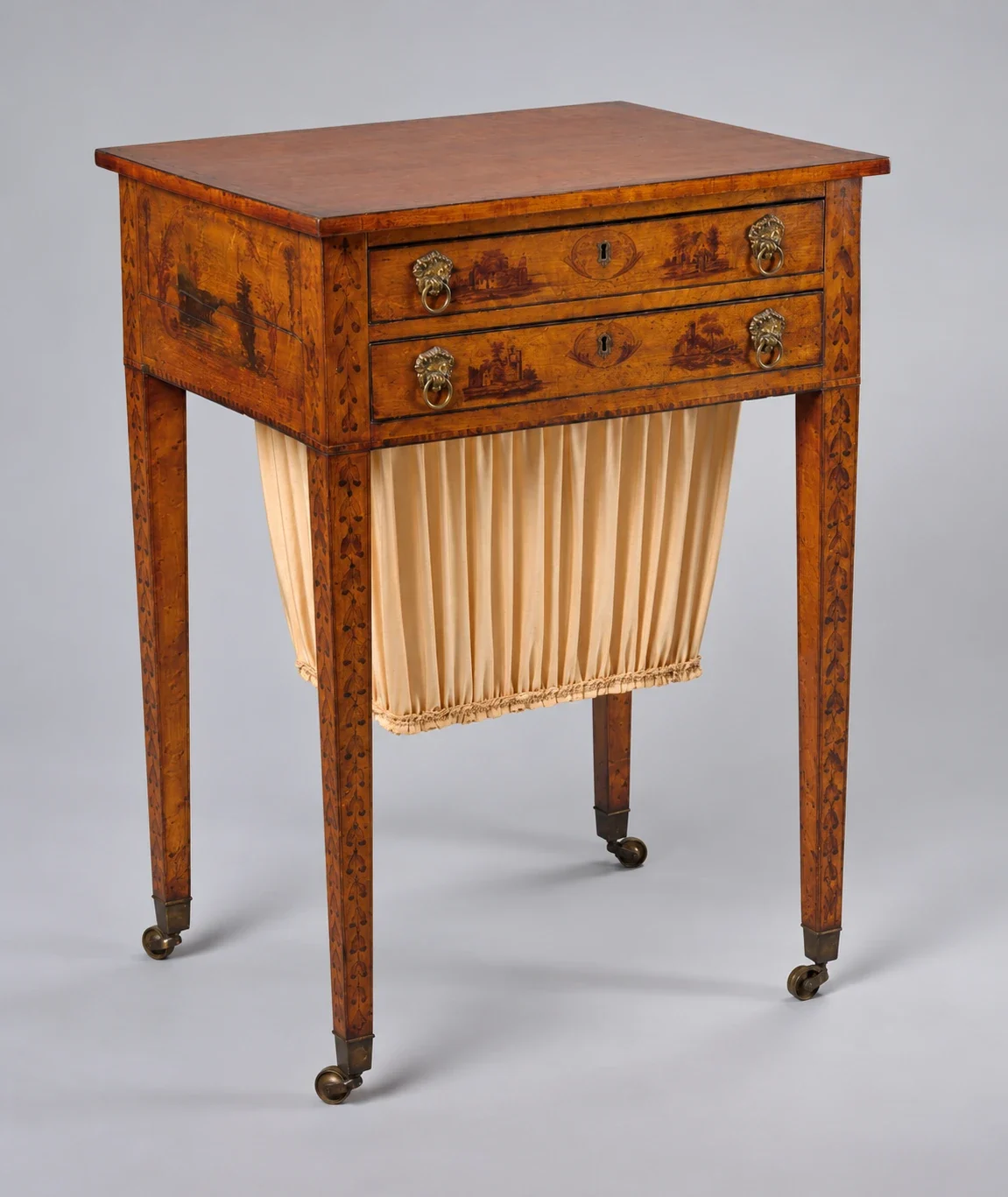 Painted work table with hanging bag and casters.