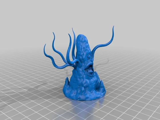 Blue tapered rocklike miniature with one eye, an open toothed mouth and long curling tentacles, standing on a rocky base over a grey grid.