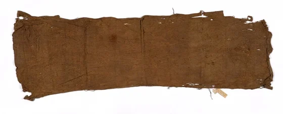 Kanak barkcloth from Ouvéa, New Caledonia, shown whole with worn edges and collection label, Te Papa FE000079