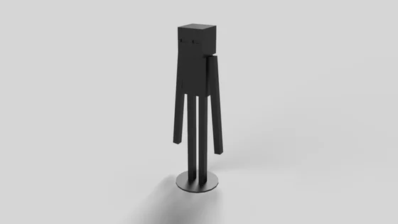 Dark grey Enderman fan-model statue with a block-shaped head, small recessed eyes, narrow torso and long straight arms and legs, standing on a round base against pale grey.