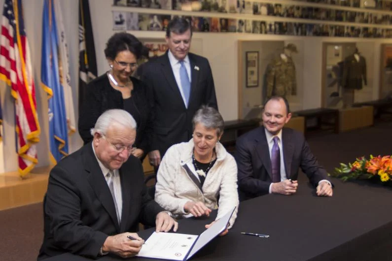 Citizen Potawatomi Nation Chairman John Barrett signing tribal leasing regulations with Secretary Sally Jewell and other officials at the November 2013 ceremony