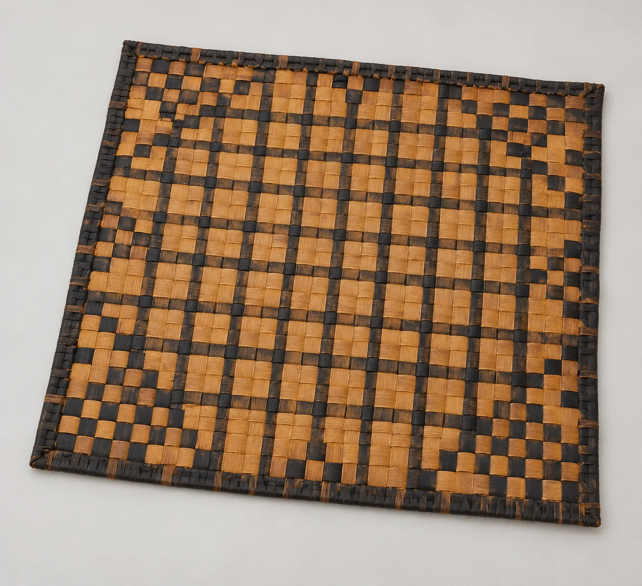 Generated contextual study of a checked cedar-bark mat.