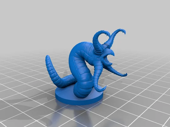 Blue coiled wormlike miniature with hooked beak and four curling tentacles around its open mouth, on a circular base over a grey grid.