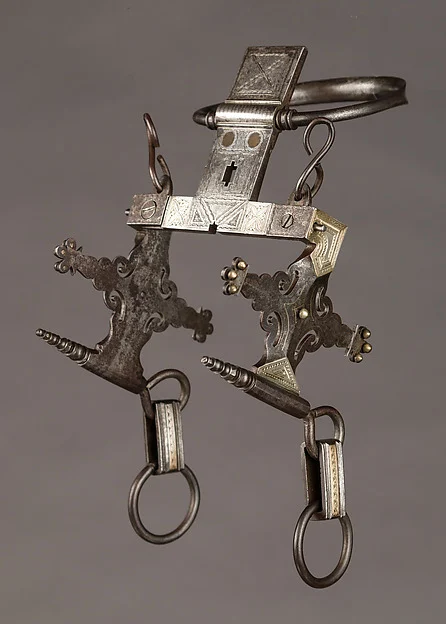 Nineteenth-century Tuareg ring bit of iron, silver and copper alloy, with decorated cheek pieces and hanging rings, Met 36.25.557